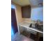 Double sink with faucet and kitchen cabinet with a window at 781 W Lancaster Rd # B38, Orlando, FL 32809