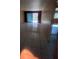 Open living area with tile flooring and glass sliding doors at 781 W Lancaster Rd # B38, Orlando, FL 32809