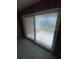 Sliding glass door with decorative privacy screen and tile flooring at 781 W Lancaster Rd # B38, Orlando, FL 32809