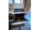 Kitchen features a four-burner electric stove top with an open oven at 781 W Lancaster Rd # B38, Orlando, FL 32809