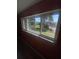 Window view showcasing community green space, swimming pool, and mature palm trees at 781 W Lancaster Rd # B38, Orlando, FL 32809