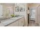 Bathroom featuring a double sink vanity, granite countertops, and shower at 9042 Stinger Dr, Davenport, FL 33896