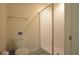Bright bathroom featuring a glass shower, toilet, and neutral wall color at 9042 Stinger Dr, Davenport, FL 33896