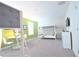 Bright bedroom features a bunk bed, TV, dresser, and table with two chairs at 9042 Stinger Dr, Davenport, FL 33896