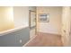 Hallway with carpet, mirror, and neutral-toned walls at 9042 Stinger Dr, Davenport, FL 33896