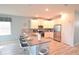 Modern kitchen with white cabinets, stainless steel appliances, and a spacious island at 9042 Stinger Dr, Davenport, FL 33896