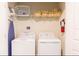 Functional laundry room with modern appliances and ample storage space at 9042 Stinger Dr, Davenport, FL 33896