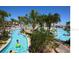Community lazy river winding through tropical landscape offers a relaxing and enjoyable experience for residents at 9042 Stinger Dr, Davenport, FL 33896