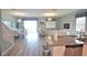 Open floor plan seamlessly connects the kitchen, dining, and living areas, promoting easy living at 9042 Stinger Dr, Davenport, FL 33896