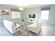 Bright living room with sleek furniture and a large television, perfect for relaxation at 9042 Stinger Dr, Davenport, FL 33896