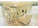 Bright living room with sleek furniture and a large television, perfect for relaxation at 9042 Stinger Dr, Davenport, FL 33896