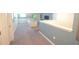 Open living room with carpet, light blue walls, and a comfortable couch at 9042 Stinger Dr, Davenport, FL 33896