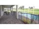 Covered patio with view of pool, spa and fenced yard at 9042 Stinger Dr, Davenport, FL 33896