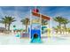 Community splash pad with colorful water features, providing a fun and refreshing experience for all ages at 9042 Stinger Dr, Davenport, FL 33896