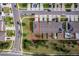 A lovely aerial view of a house and surrounding community featuring well-maintained landscaping and ample parking at 9056 Wildflower Ln, Kissimmee, FL 34747
