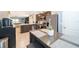 Open-concept kitchen with a dining area that seats two at 9056 Wildflower Ln, Kissimmee, FL 34747