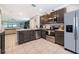 Well-lit kitchen with modern appliances and an open view to the living area at 9056 Wildflower Ln, Kissimmee, FL 34747