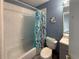 Cozy bathroom featuring a bathtub with a shower curtain, toilet, and vanity at 914 Caribbean Dr, Davenport, FL 33897