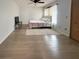 Well-lit bedroom with hardwood floors, a ceiling fan, and a comfy bed topped with a floral comforter at 914 Caribbean Dr, Davenport, FL 33897