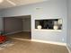 Bright living room with tile floors, open layout to the kitchen, and neutral paint color at 914 Caribbean Dr, Davenport, FL 33897