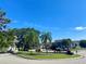 Scenic street view with palm trees and well-maintained community entrance at 914 Caribbean Dr, Davenport, FL 33897