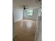 Bright bedroom features modern wood flooring, windows, and ceiling fan at 924 Ferndell Rd, Orlando, FL 32808