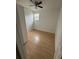 Clean bedroom features modern wood flooring, and natural light from a window at 924 Ferndell Rd, Orlando, FL 32808