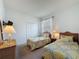 Bedroom with two twin beds and a closet for ample storage space at 925 Montana Ave, Davenport, FL 33897