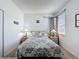 Cozy bedroom featuring a queen bed with two windows allowing for ample natural light at 925 Montana Ave, Davenport, FL 33897