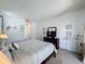 Bright bedroom featuring a king bed, carpeting, and plenty of space for comfortable living at 925 Montana Ave, Davenport, FL 33897