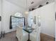 Bright dining room with large windows and elegant chandelier, ideal for formal dinners at 925 Montana Ave, Davenport, FL 33897