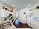 Well-lit kitchen with white cabinets, stainless sink, and modern appliances at 925 Montana Ave, Davenport, FL 33897