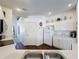 Bright kitchen featuring white cabinets, stainless sink, and modern appliances at 925 Montana Ave, Davenport, FL 33897