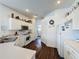 Bright kitchen featuring white cabinets, stainless sink, and modern appliances at 925 Montana Ave, Davenport, FL 33897