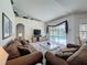 Cozy living room with neutral carpet and views of the pool at 925 Montana Ave, Davenport, FL 33897