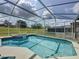 Sparkling screened-in pool with a hot tub, perfect for relaxation and entertaining at 925 Montana Ave, Davenport, FL 33897
