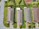 Aerial view displays the property's roof, driveway, and surrounding green landscape, providing a sense of space at 105 Palazzo Ln, Kissimmee, FL 34759