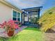 Charming patio with outdoor kitchen, lush landscaping and a cozy place to relax at 105 Palazzo Ln, Kissimmee, FL 34759