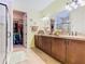 Large bathroom with double vanity, walk-in closet, separate shower, and plenty of storage space at 105 Palazzo Ln, Kissimmee, FL 34759