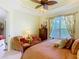 Comfortable bedroom featuring a ceiling fan and stylish furnishings creating a relaxing retreat at 105 Palazzo Ln, Kissimmee, FL 34759