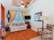 Cozy bedroom showcasing a decorative ceiling fan and plenty of natural light at 105 Palazzo Ln, Kissimmee, FL 34759