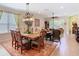 Open concept dining room with elegant chandelier and plenty of space to entertain at 105 Palazzo Ln, Kissimmee, FL 34759