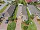 Overhead view featuring a beautiful single-Gathering home with a brick driveway and lush green landscaping at 105 Palazzo Ln, Kissimmee, FL 34759