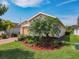 A charming single-Gathering home featuring lush landscaping, lawn and covered entry at 105 Palazzo Ln, Kissimmee, FL 34759