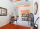 Cozy living room area featuring a colorful decor, tiled flooring and a view of the front entryway at 105 Palazzo Ln, Kissimmee, FL 34759