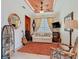 Cozy living room with an ornate ceiling fan, a comfortable white sofa and a colorful rug at 105 Palazzo Ln, Kissimmee, FL 34759