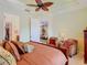 Main bedroom with decorative ceiling fan and an entry view to the living room at 105 Palazzo Ln, Kissimmee, FL 34759