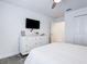 Bright bedroom with a ceiling fan, closet, and a stylish dresser at 1058 Splash Shot Pl, Davenport, FL 33896