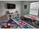 Bedroom featuring twin beds, a TV, and themed decor at 1058 Splash Shot Pl, Davenport, FL 33896
