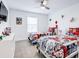 Fun bedroom featuring two twin beds with superhero-themed bedding at 1058 Splash Shot Pl, Davenport, FL 33896